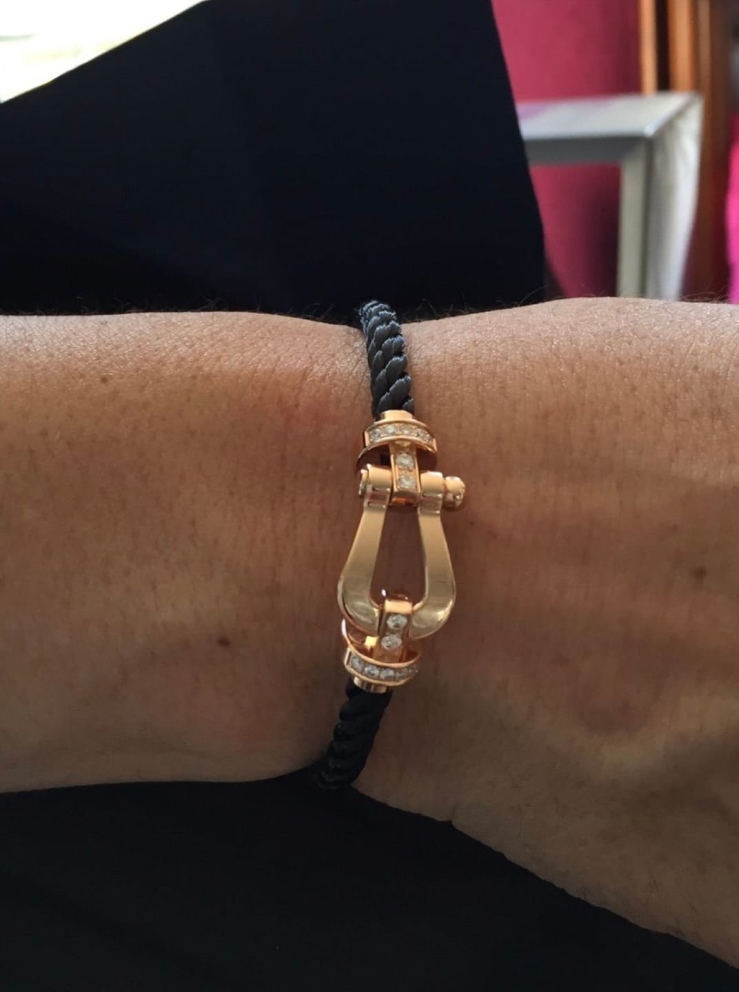 Customer photo review of צמיד יוקרתי עם רצועת חבל שחורה ואבזם בגוון זהב ורוד משובץ בחצי זירקונים