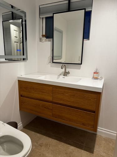 Customer's Saggia Floating Vanity shown mounted on the wall, featuring a wood finish and double sink.