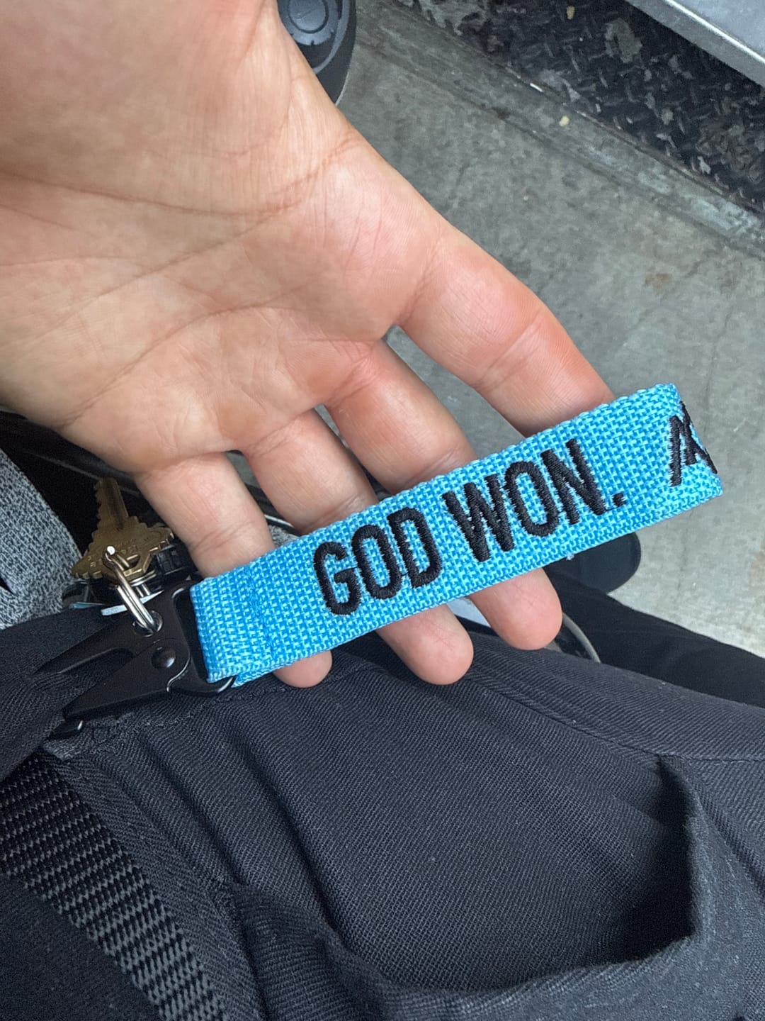 Customer photo review of ‘God Won’ Embroidered Keychain