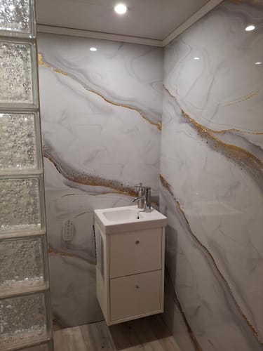 Customer photo review of Panneau Mural PVC Effet Marbre Doré – Étanche et facile à poser