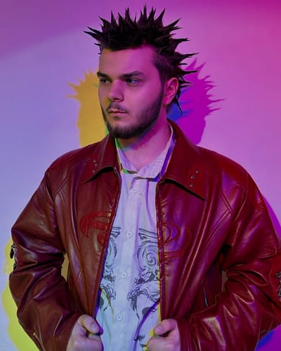 Reviewer posing in a red Personsoul Croc Effect Panel Leather Jacket over a patterned shirt.