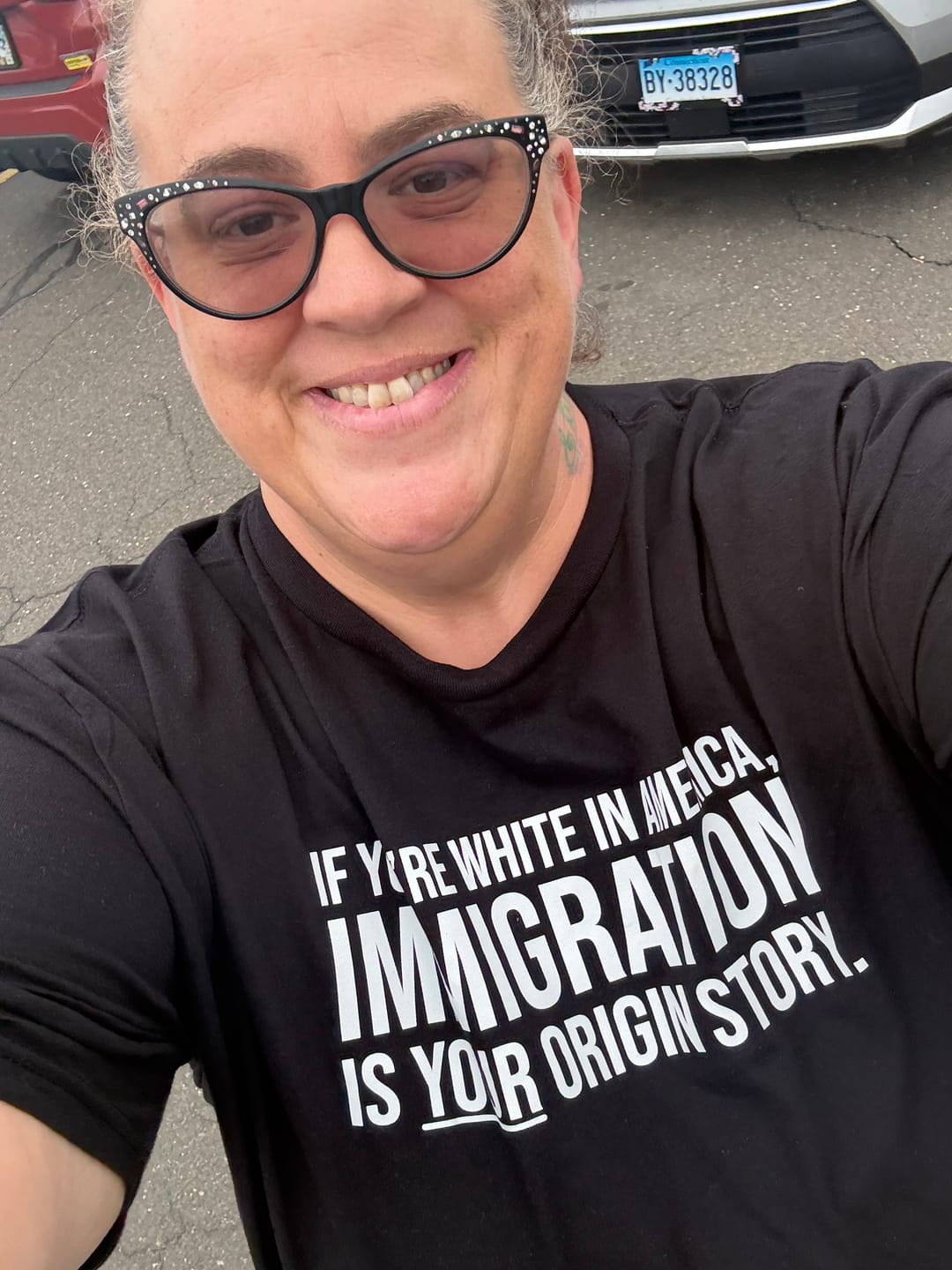 Customer photo review of If you're white in America, IMMIGRATION is your origin story Unisex Tee