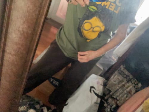 Reviewer wearing the green John Lemon T-Shirt in a mirror photo.