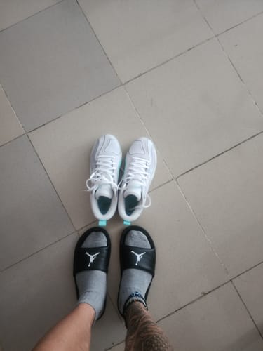 Customer's white Jordan Jayson Tatum 3 PF basketball shoes shown on a tiled floor.