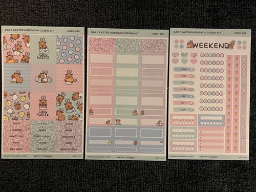 Customer's three sticker sheets from the Capy Easter Hobonichi Cousin Weekly Kit, featuring cute Easter-themed capybaras.