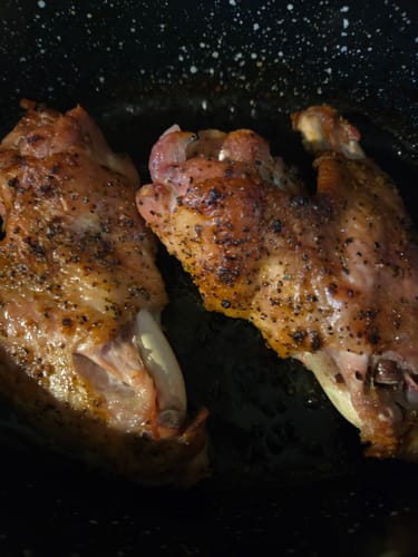 Reviewer's two delicious Halal Turkey Wings, seasoned and cooked in a pan.