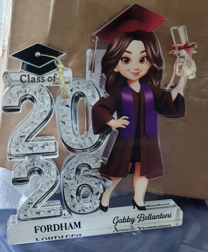 Customer's personalized 'Class of 2026' acrylic plaque, customized with a name and 'FORDHAM' on its base, shown on a surface.