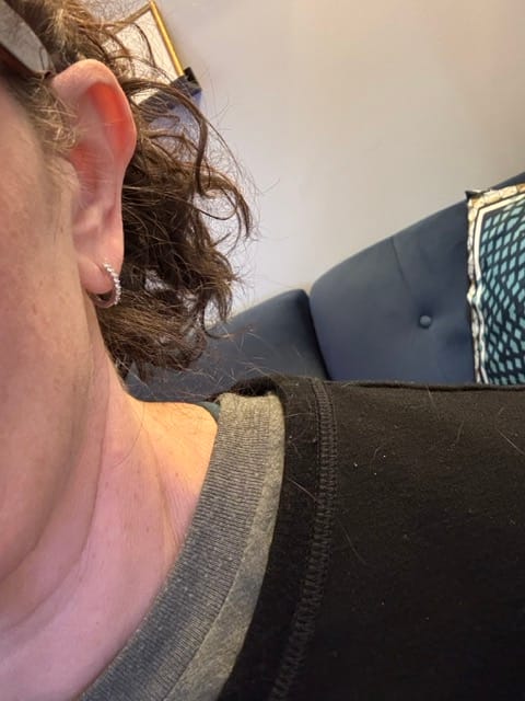 Customer photo review of Versa Single Spark Lab Grown Diamond Huggies Hoop Earrings