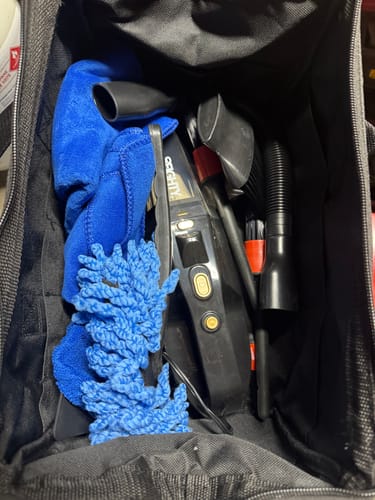 Customer's 80Eighty® Car Detail Set packed inside the black tool bag, showing the vacuum and blue cleaning tools.