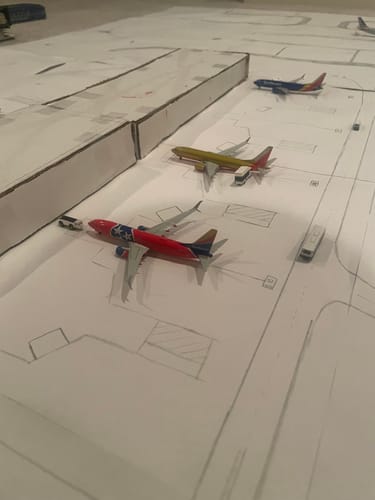 Customer's Gemini Southwest Tennessee One model plane on a hand-drawn model airport display.