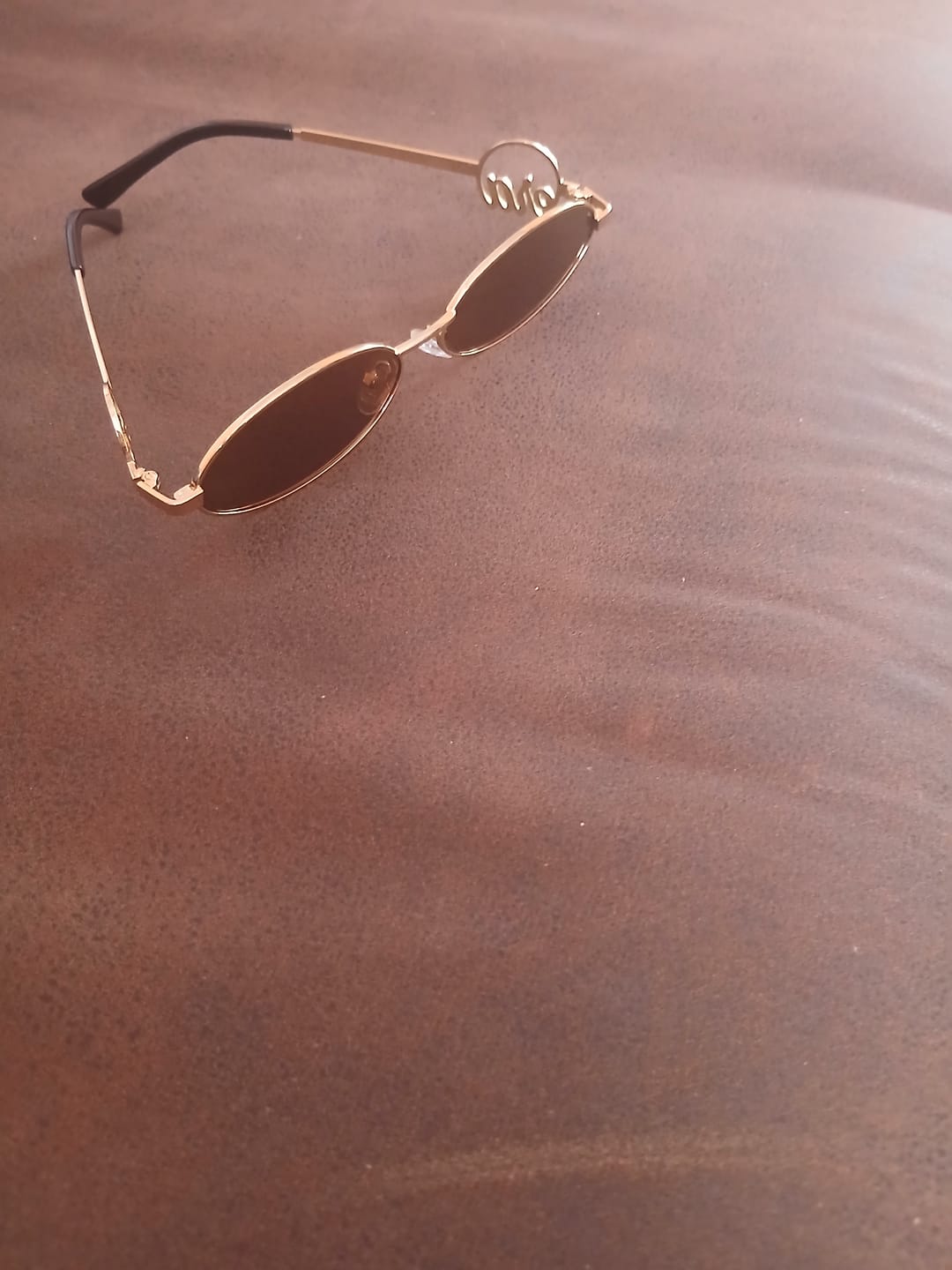 Customer photo review of Muse Logo Sunglasses – Gold Edition