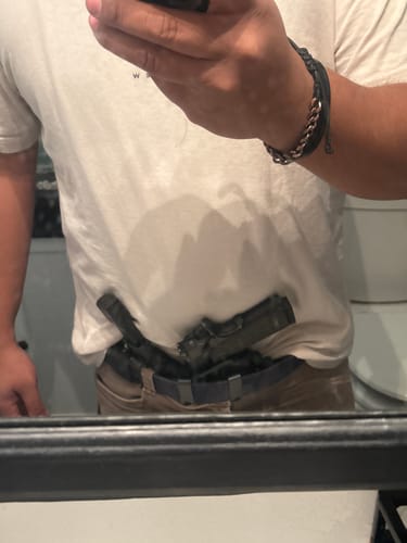 Reviewer showing the MSP PRO SERIES holster carrying a 1911 pistol in the appendix position.