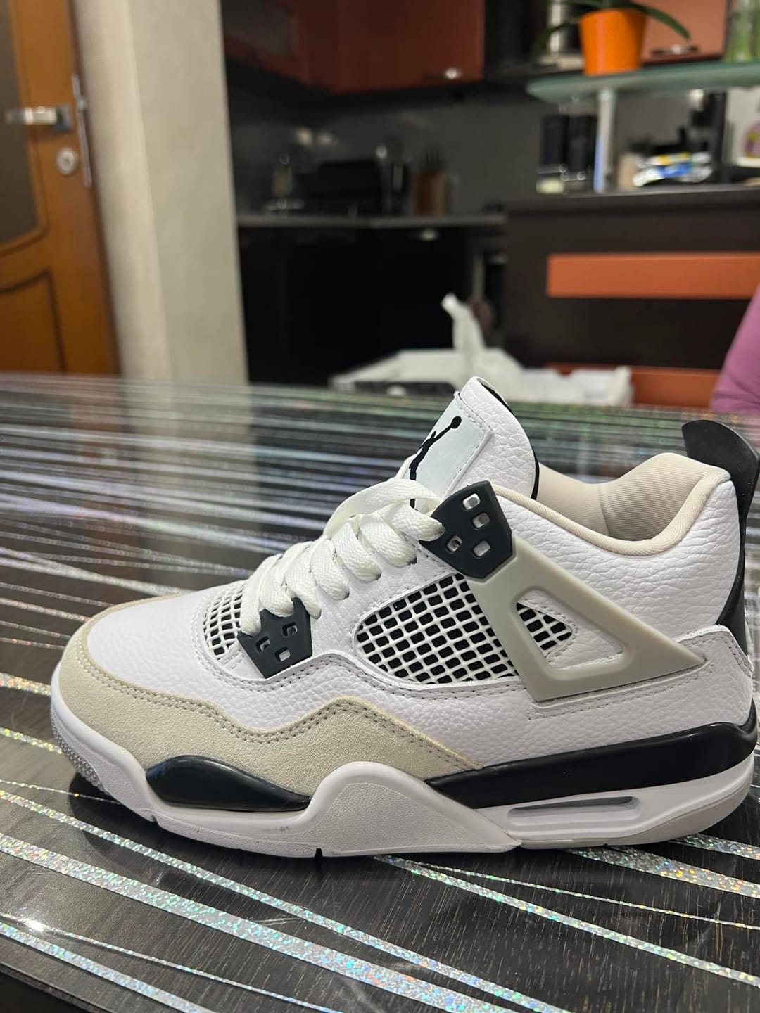 Customer photo review of Jordan 4 Retro 'Military Black'