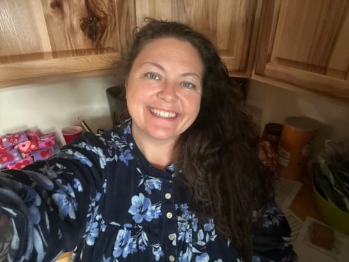 Reviewer smiling, showing her clear skin after using the Grass Fed Tallow & Honey Balm.