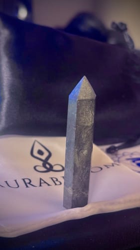 Reviewer's Natural Hematite Crystal Point standing upright, showing its dark metallic finish.
