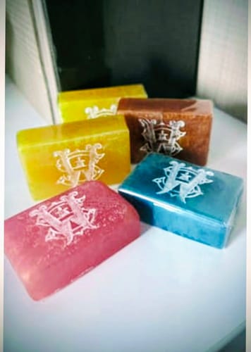 A customer's collection of five colorful Tabac Soleil Perfume Infused Soap Bars displayed on a table.