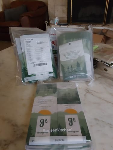 Packaging for the customer's Flower Trifecta bundle, showing the three bags on a table.