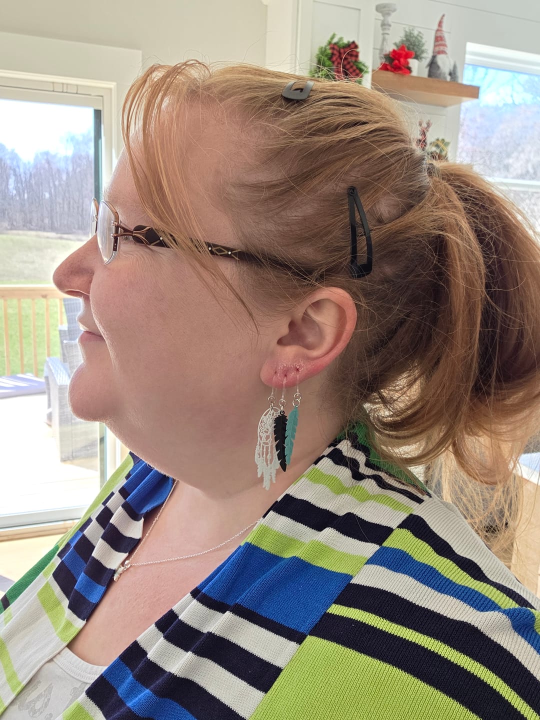 Customer photo review of Dainty Feather Dangles