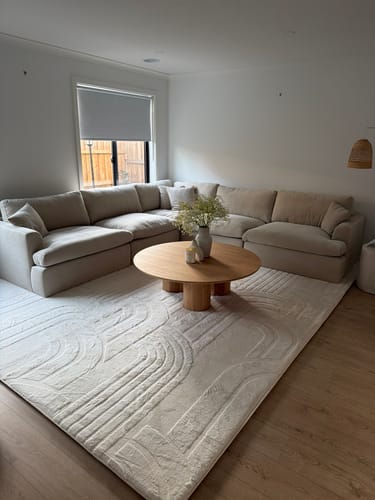 Customer's cream Mellow Mat Cloud Haven 3D rug with a carved pattern, shown in a living room.