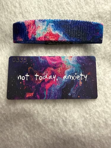 Customer's Not Today, Anxiety Bracelet and matching card, both with a colorful galaxy design.