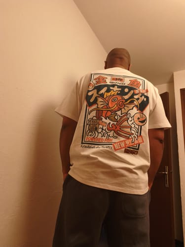 Reviewer from behind wearing the Koi King T-Shirt, showing the large and colorful back graphic.