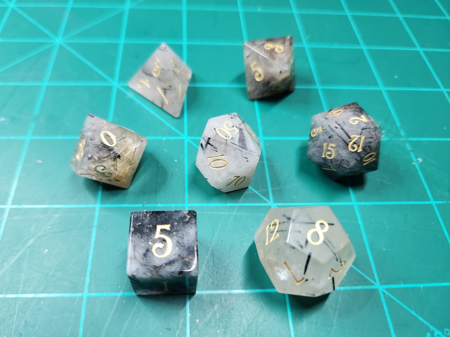 Customer photo review of URWizards D&D Black Rutilated Quartz Gemstone Engraved Dice Set(Limited edition)