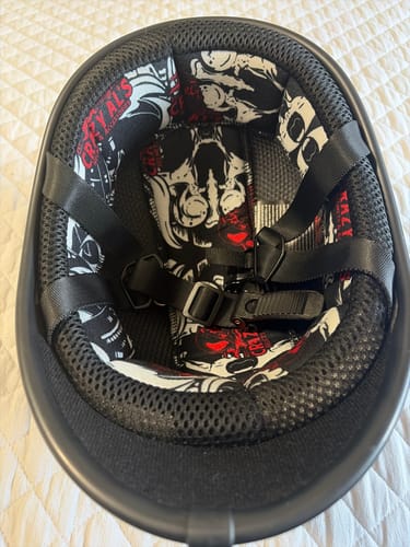 Customer's view inside the Polo Switchback helmet, showing the padded, skull-patterned lining and straps.