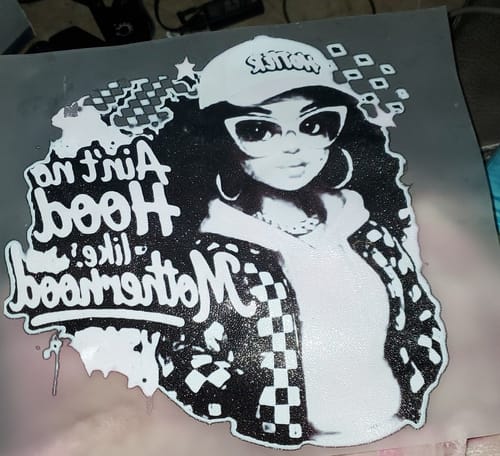 Customer's black and white DTF transfer showing a design of a woman with text that reads 'Ain't no Hood like Motherhood'.