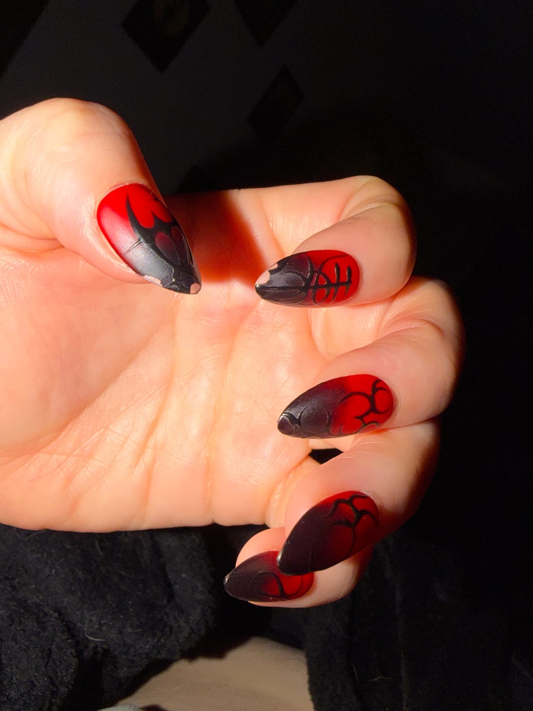 Customer photo review of Crimson Sigil Press-On Nails – Matte Red Fake Nails with Gothic Symbols & Dark 3D Art