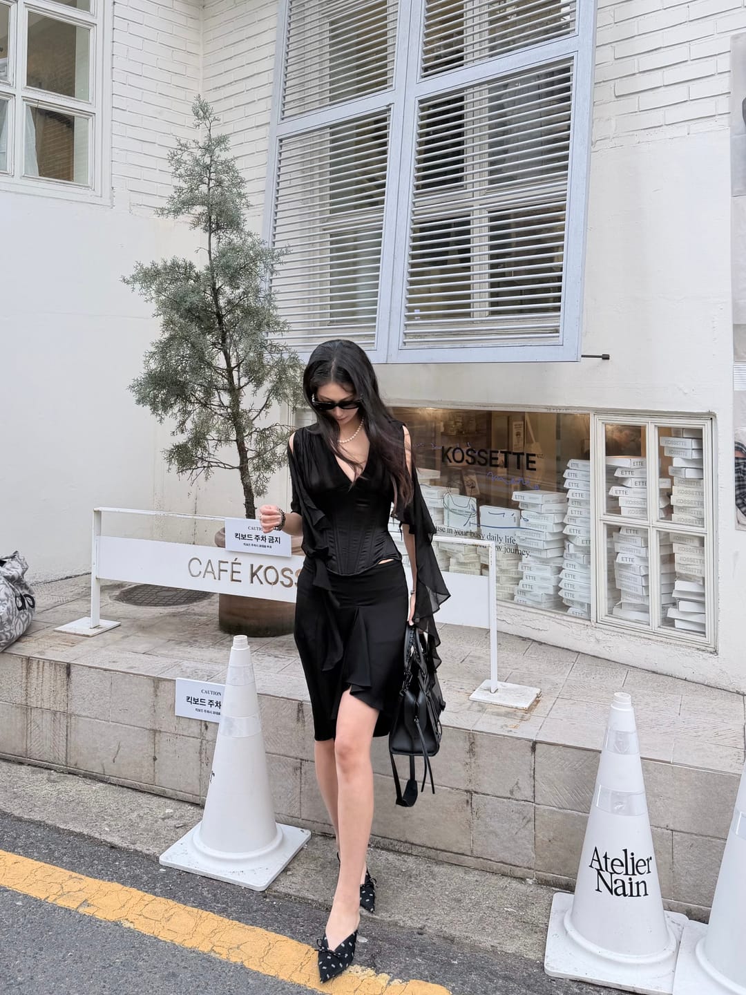 Customer photo review of ROVENTE Asymmetric Draped Mini Skirt Low Rise Fluid Ruffle Hem Bias Cut Skirt