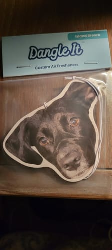 Customer's custom air fresheners in packaging, featuring a photo of a black dog's head.