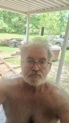Customer selfie submitted with a review for the ClarityMax wireless hearing aids.