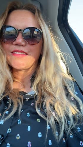 Customer wearing the black Star Wars™ “Lil Troopers (Dark Side)” shirt while sitting in a car.