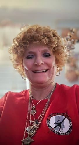 Customer smiling in her short, curly blonde Outre Duby Wig.