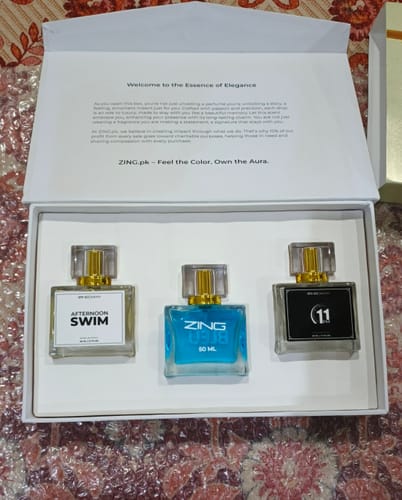 Reviewer's open Summer Box, showing the three included perfumes: Afternoon Swim, Bleu De Zing, and 11 PM.