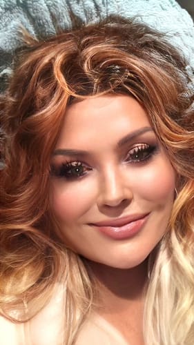 Reviewer's close-up photo showing a glowing complexion after using Koriderm™ Time Reverse Cream.