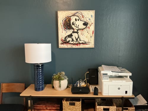 Reviewer's Abstract Dog Graffiti Wall Art hanging on a dark wall in a home office setting.