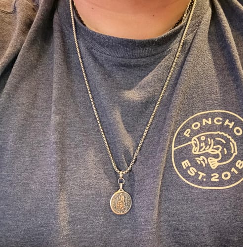 Customer wearing the shiny 3mm Round Box Link Chain with a special pendant against a grey t-shirt.