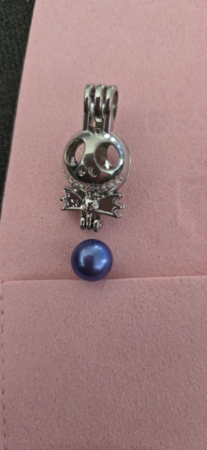 Customer photo review of Cage Pendant Silver Plated - Nightmare Before Christmas Jack Skellington Bow Tie