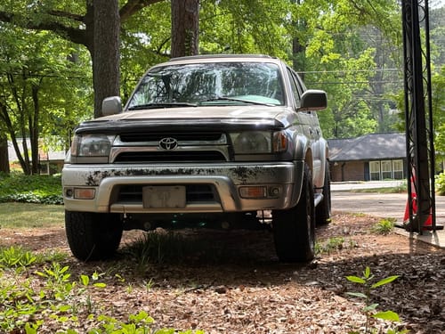 Customer's silver 4Runner parked outdoors showing the wider stance from the installed wheel spacers.