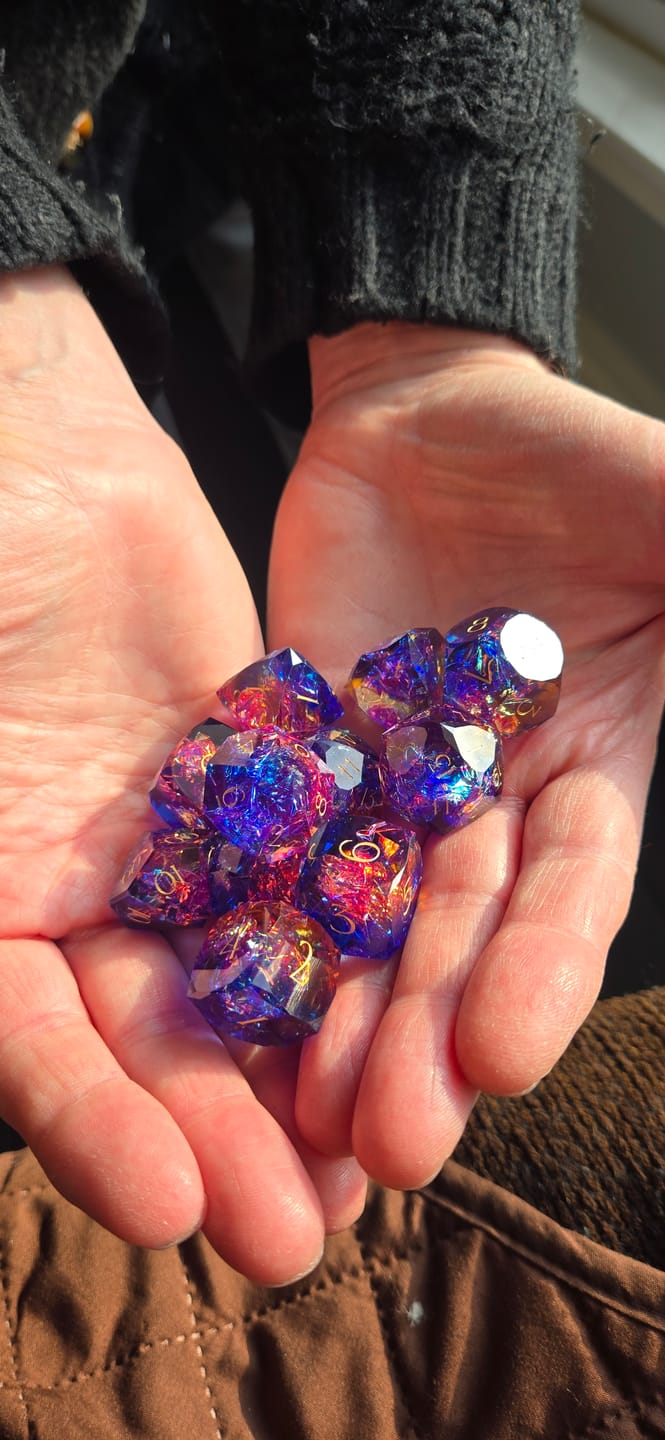 Customer photo review of URWizards D&D Resin Cosmic Burn Engraved Dice Set Multi-faceted Style