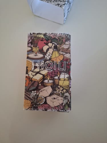 Customer's photo of the colorful, illustrated box for the Coconut Vanilla Fragrance Oil on a white surface.