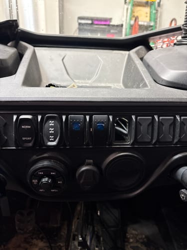 Customer's close-up of the NUTV5-S QUAD sound system controller installed on a vehicle's dashboard.
