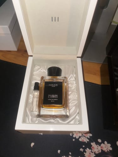 Customer's Rhubarb & Cognac fragrance and small vial inside a white presentation box.
