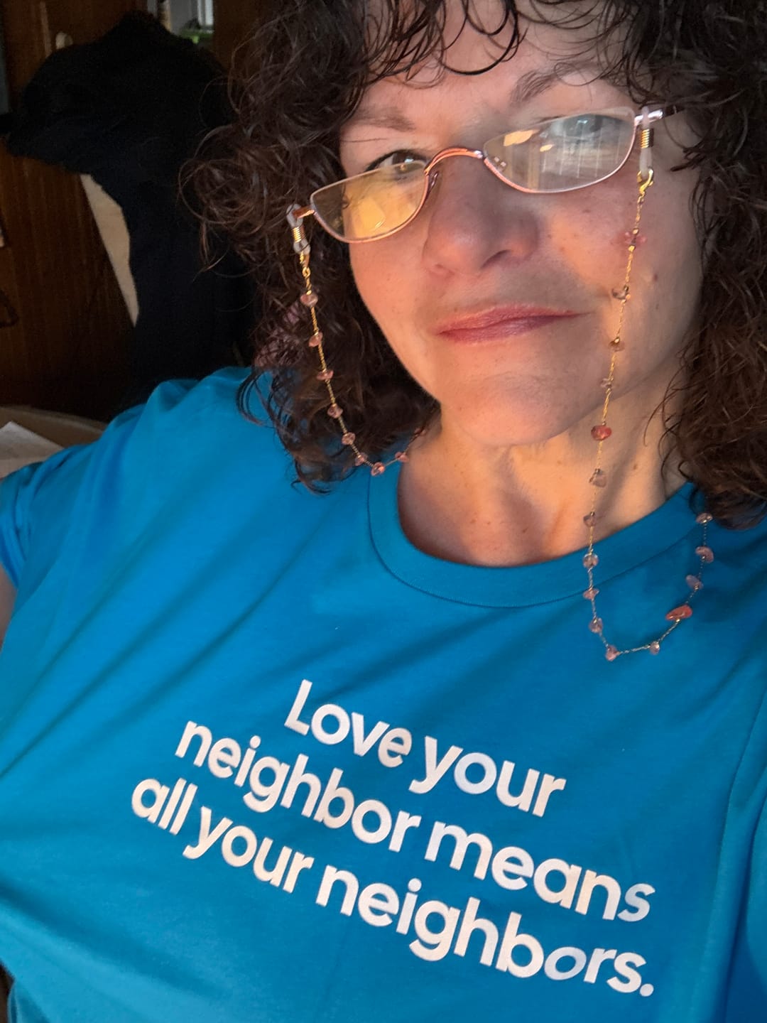 Customer photo review of Love Your Neighbor Means All Your Neighbors Unisex Tee