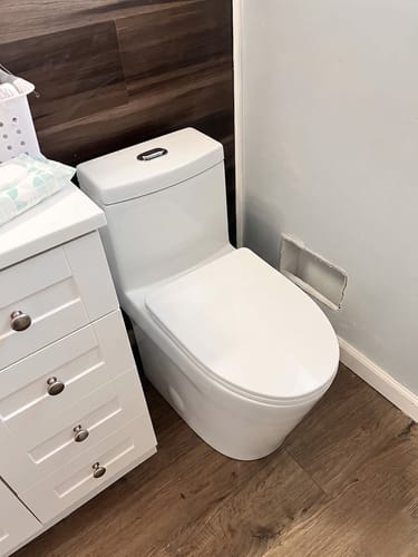 Customer photo review of Are - One-Piece 1.1/1.6 GPF Dual Flush Round Toilet in White Soft Close Seat Included