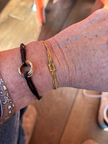 Customer's image for a Shipping Insurance review, showing bracelets on a wrist.