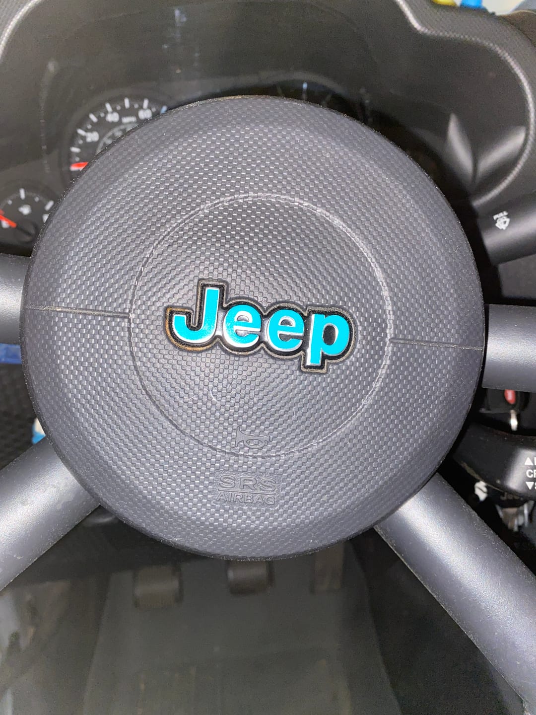Customer photo review of JEEP Steering Wheel Emblem Overlay Decal — 30+ Colors & Designs (Flag, Topo, Animal, Solid)