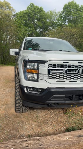 Customer's white truck with a wider stance after installing the 2-inch hubcentric wheel spacers.