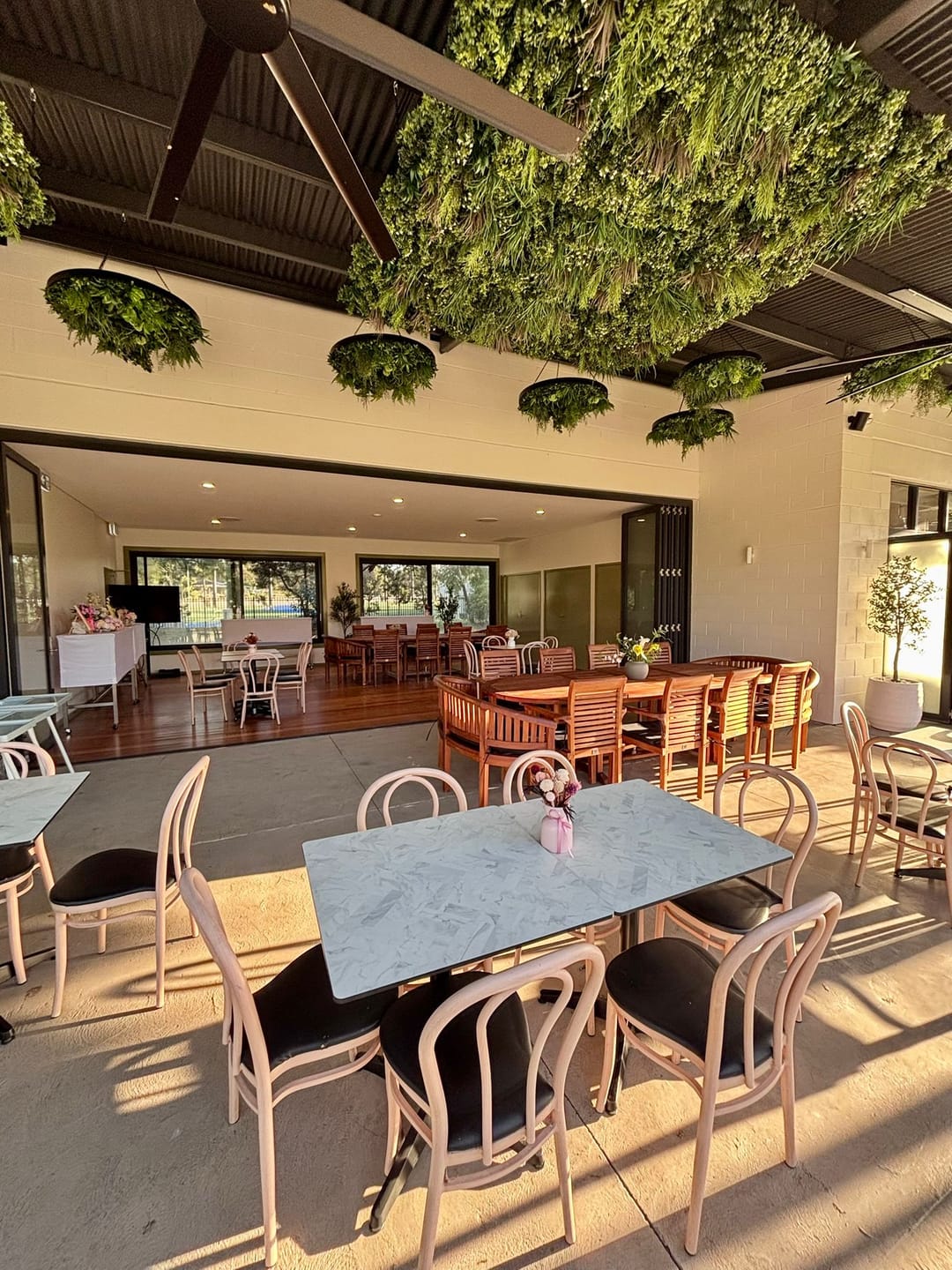 Customer photo review of Teak Oval 2–3m Extending Table 4cm Top (8 Oxford Stacking Chairs, 2 San Francisco Benches): Large Dining Set for Outdoors
